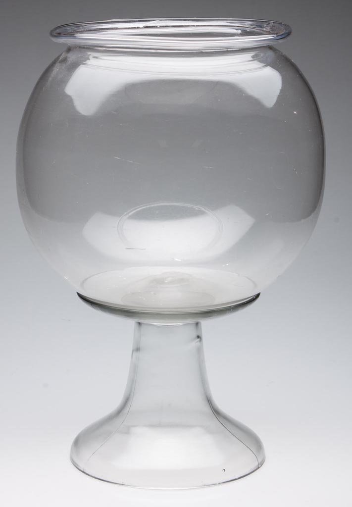 FREE-BLOWN FISH GLOBE: FREE-BLOWN FISH GLOBE, colorless, folded rim and rough pontil mark, raised on original pressed glass standard. American. Fourth quarter 19th century. 15" HOA, 7 3/4" D rim, 6 3/4" D foot. Provenance: 