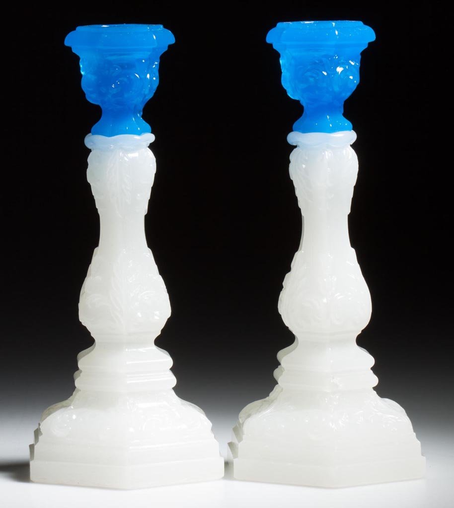 PAIR OF PRESSED ACANTHUS LEAF CANDLESTICKS: PAIR OF PRESSED ACANTHUS LEAF CANDLESTICKS, translucent starch blue above alabaster/clambroth with only a very lightly sanded surface near the bases, small size, each hexagonal socket raised on a balu