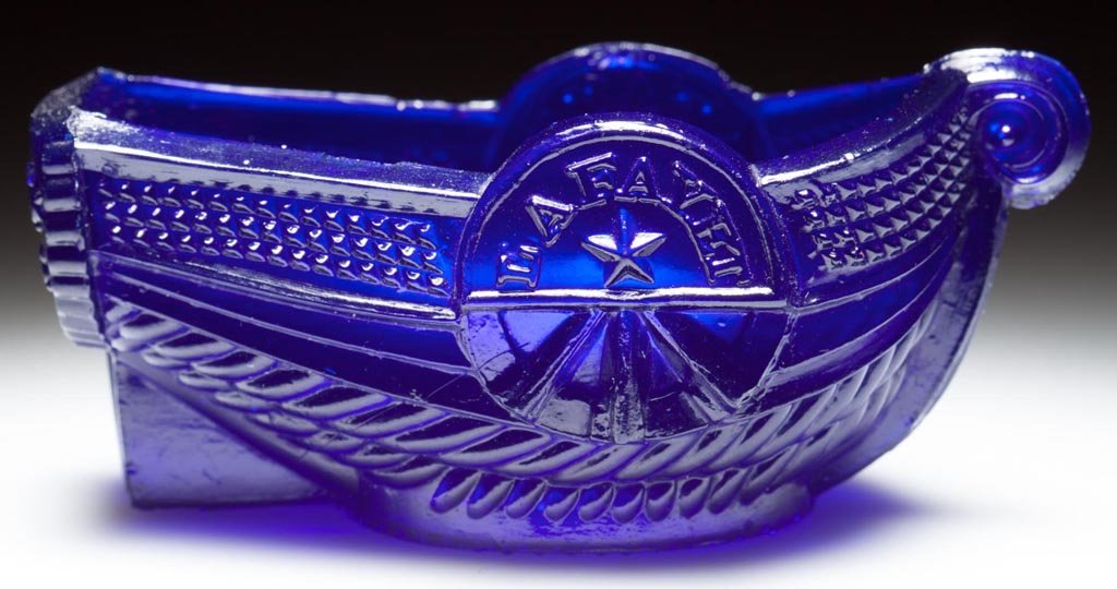 BT-4D "LAFAYET" STEAMBOAT PRESSED OPEN SALT: BT-4D "LAFAYET" STEAMBOAT PRESSED OPEN SALT, deep brilliant cobalt blue, marked "B. &. S. / GLASS. / Co" on stern and "SANDWICH" on interior base. Rare. Boston & Sandwich Glass Co. 1830-1845. 1 1/2" H