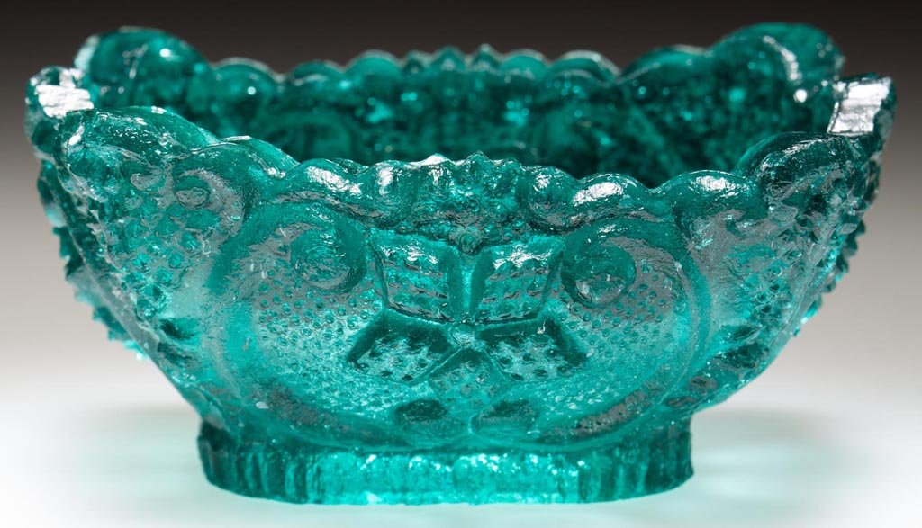 OL-18A VARIANT DIAMOND STAR AND SCROLL OVAL PRESSED: OL-18A VARIANT DIAMOND STAR AND SCROLL OVAL PRESSED OPEN SALT, unlisted strong blue green, complex shaped rim, crude design. Base variation without the center stippling. Extremely rare, possibly uniqu