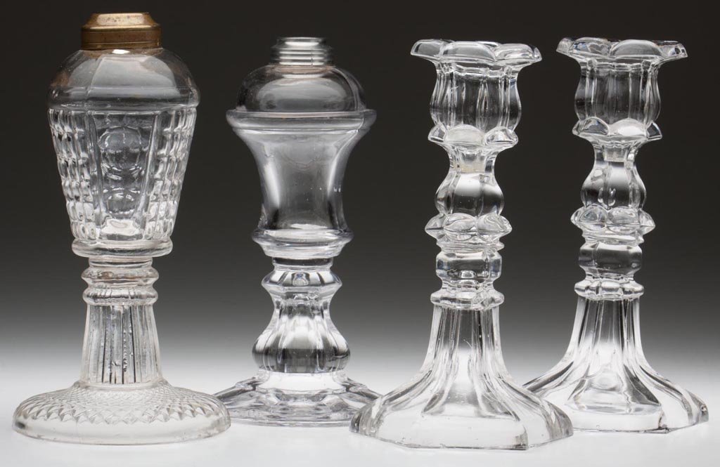 ASSORTED EARLY LIGHTING DEVICES, LOT OF FOUR: ASSORTED EARLY LIGHTING DEVICES, LOT OF FOUR, colorless lead glass, including a blown-molded Waffle and Thumbprint whale oil lamp with pressed base and a pair of Petal and Hexagonal candlesticks. 1840