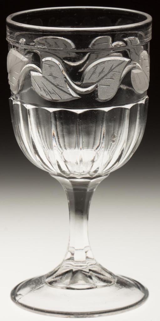 FROSTED LEAF CHAMPAGNE GLASS: FROSTED LEAF CHAMPAGNE GLASS, colorless lead glass. Third quarter 19th century. 5 1/4" H. Literature: Parallels Metz - Early American Pattern Glass I, p. 26, fig. 236. Provenance: From a Vermont priva