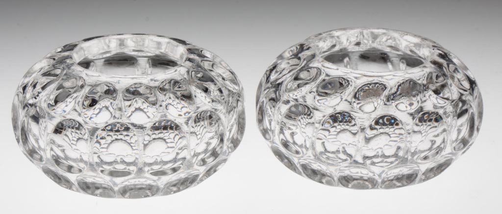 EARLY THUMBPRINT / ARGUS (OMN) PAIR OF MASTER SALTS: EARLY THUMBPRINT / ARGUS (OMN) PAIR OF MASTER SALTS, colorless lead glass, each compressed globular form with four rows of thumbprints, plain inward rolled rim, polished pontil mark. Probably Bakewell