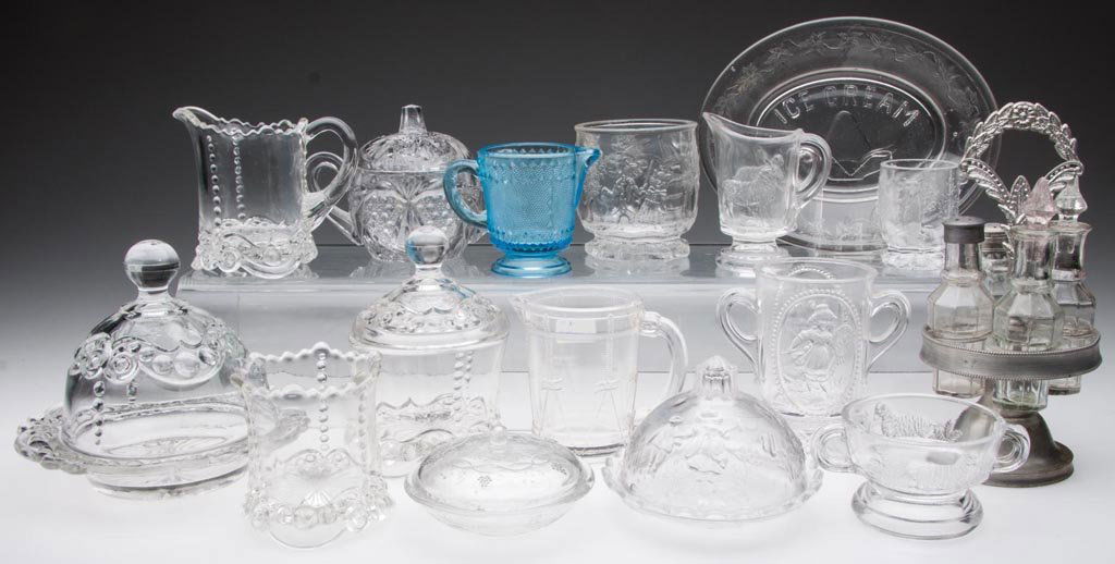 ASSORTED CHILDREN'S TOY GLASS TABLE ARTICLES, LOT OF 16: ASSORTED CHILDREN'S TOY GLASS TABLE ARTICLES, LOT OF 16, colorless and blue, including a Bead and Scroll four-piece table set. First quarter 20th century. Various sizes. Provenance: From the collectio