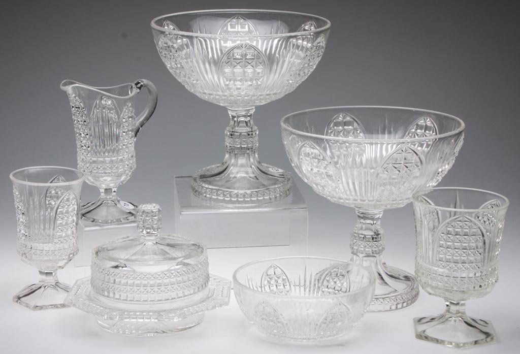 CATHEDRAL / ORION (OMN) SEVEN-PIECE TABLE SET: CATHEDRAL / ORION (OMN) SEVEN-PIECE TABLE SET, colorless, including two open compotes, a covered butter, and a creamer with applied handle. Bryce Bros. / U.S. Glass Co. Circa 1890-1892. 2 1/4" to 8 1/