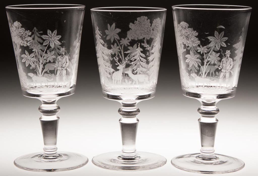 DEER AND DOG GOBLETS, LOT OF THREE: DEER AND DOG GOBLETS, LOT OF THREE, colorless, etched design, tapered bowl/Gillinder No. 402 blank, Mordock Stem J. Gillinder & Sons. Fourth quarter 19th century. 6 1/4" to 6 3/8" H. Provenance: Colle