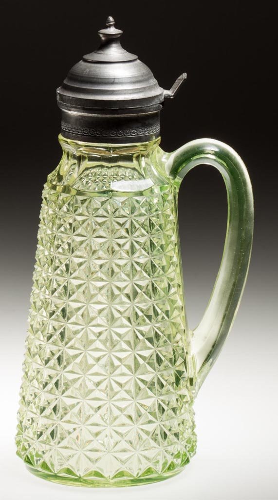 DUNCAN NO. 800 / HEAVY FINECUT SYRUP PITCHER: DUNCAN NO. 800 / HEAVY FINECUT SYRUP PITCHER, vaseline (uranium), with period lid. Geo. Duncan & Sons. Fourth quarter 19th century. 8 5/8" HOA. Provenance: Collection of Jessie and the late Eugene Lon