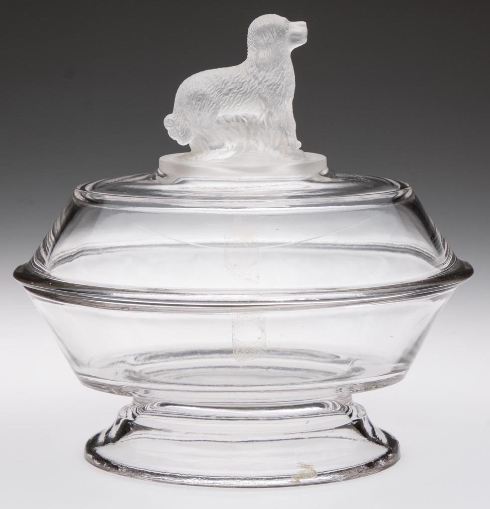 FROSTED DOG SMALL OVAL COVERED BOWL: FROSTED DOG SMALL OVAL COVERED BOWL, colorless with frosted finial. Fourth quarter 19th century. 7 1/4" HOA, 7" x 5 1/4". Provenance: From the collection of the late Betty Jane Renn, Sunbury, PA.