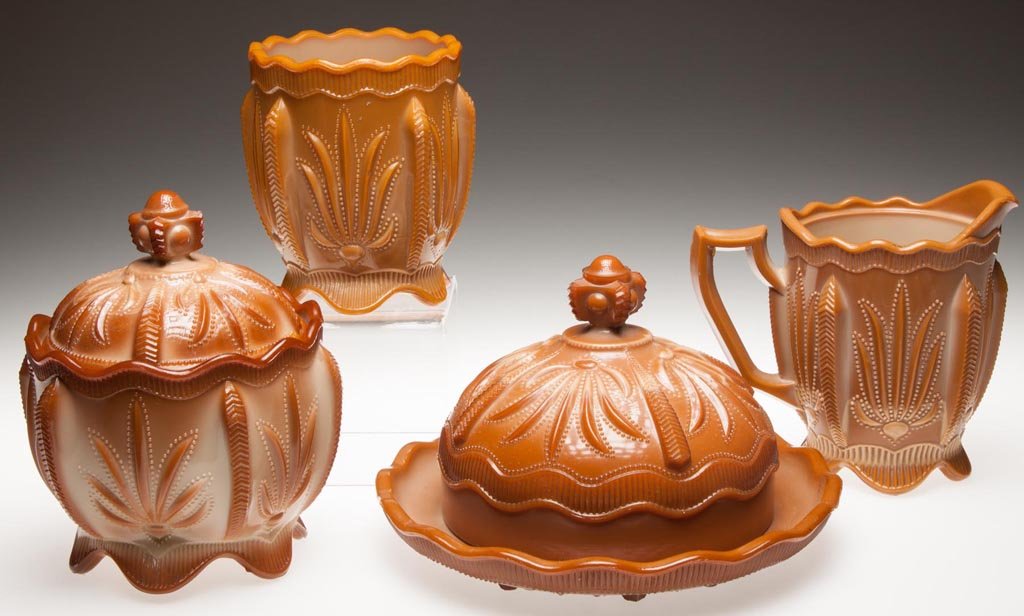 GREENTOWN NO. 375 / CACTUS FOUR-PIECE TABLE SET: GREENTOWN NO. 375 / CACTUS FOUR-PIECE TABLE SET, chocolate, comprising a covered butter dish, covered sugar bowl, creamer, and spooner. Indiana Tumbler and Goblet Co. Pattern introduced 1902. 5" to 8 