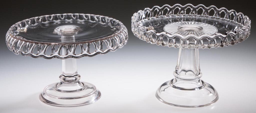 LACE EDGE CAKE STANDS, LOT OF TWO: LACE EDGE CAKE STANDS, LOT OF TWO, colorless, each on raised paneled standards with plain feet. No. 33 with skirt and No. 44 with raised rim. Cooperative Glass Co. Fourth quarter 19th century. 5 3/4" 
