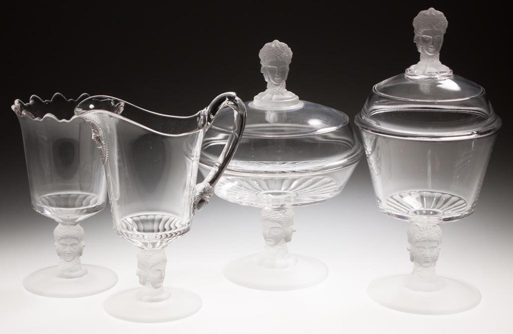 THREE FACE / DUNCAN NO. 400 FOUR-PIECE TABLE SET: THREE FACE / DUNCAN NO. 400 FOUR-PIECE TABLE SET, colorless and frosted, comprising a covered butter dish, covered sugar bowl, creamer with profile under spout and at base of handle, and spooner. Geo.