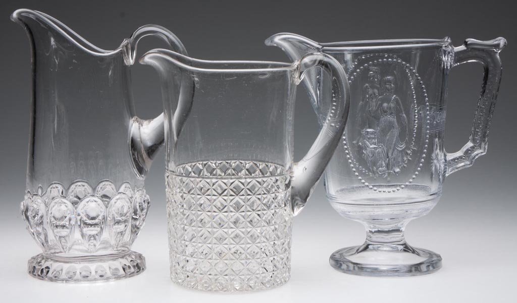 ASSORTED EAPG MILK PITCHERS, LOT OF THREE: ASSORTED EAPG MILK PITCHERS, LOT OF THREE, colorless, comprising Cupid and Venus, Mascotte, and Torpedo, latter two each with applied handle. Fourth quarter 19th century. 7 3/8" to 8 3/4" HOA. Provena