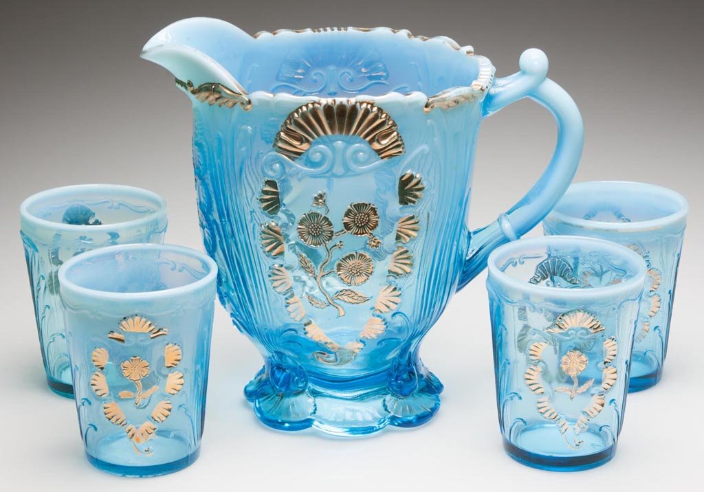 CARNELIAN / EVERGLADES FOUR-PIECE WATER SET: CARNELIAN / EVERGLADES FOUR-PIECE WATER SET, blue opalescent with gilt decoration. Northwood Glass Co. Fourth quarter 19th century. Provenance: From a Washington state private collection.