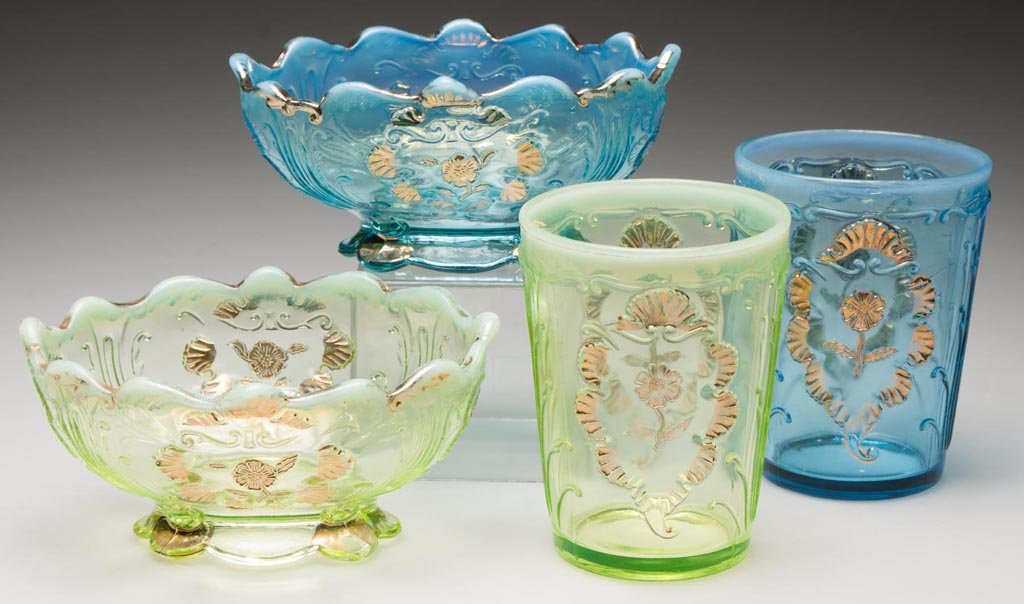 CARNELIAN / EVERGLADES ASSORTED TABLE ARTICLES, LOT OF: CARNELIAN / EVERGLADES ASSORTED TABLE ARTICLES, LOT OF FOUR, blue opalescent and vaseline (uranium) opalescent with gilt decoration, comprising two tumblers and two footed bowls. Northwood Glass Co. F
