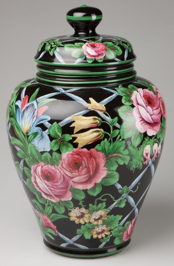 GERMAN POTTERY FRANZ ANTON MEHLEM, ROYAL BONN FACTORY T: GERMAN POTTERY FRANZ ANTON MEHLEM, ROYAL BONN FACTORY TAPERING GINGER JAR AND FLAT-TOPPED COVER WITH FLATTENED CYLINDRICAL KNOP, the body painted black, with green bands to edges, the body and cover p