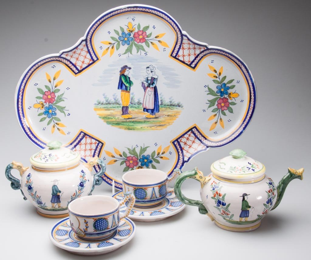 FRENCH POTTERY HENRIOT QUIMPER TEA- AND TABLE ARTICLES,: FRENCH POTTERY HENRIOT QUIMPER TEA- AND TABLE ARTICLES, LOT OF SEVEN, including a globular teapot and cover; sugar and cover and creamer, with dragon-head spout and handles; with yellow and green conc