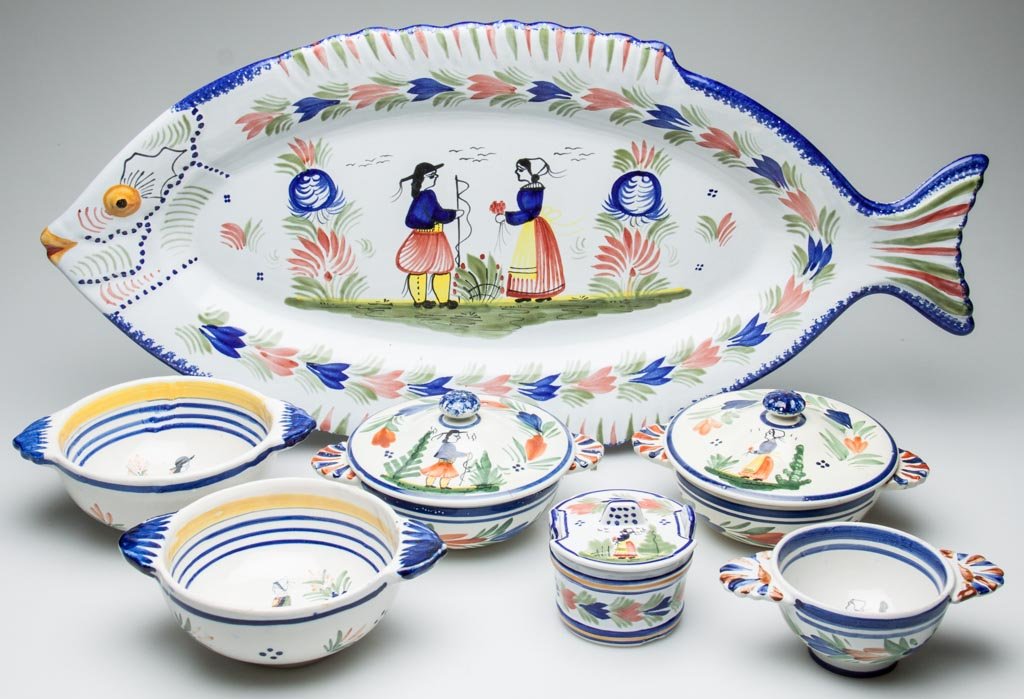 FRENCH POTTERY HENRIOT QUIMPER TABLE ARTICLES, LOT OF E: FRENCH POTTERY HENRIOT QUIMPER TABLE ARTICLES, LOT OF EIGHT, INCLUDING A LARGE FISH-SHAPED SERVING DISH, two covered soup bowls; two bowls with lug handles, a smaller lug-handled bowl with patriotic l