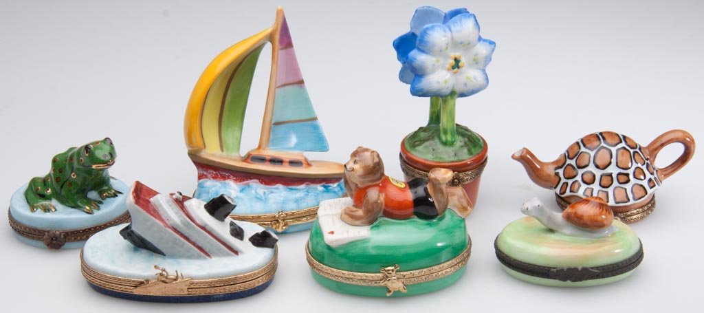 FRENCH PORCELAIN LIMOGES HAND-PAINTED LIMITED EDITION P: FRENCH PORCELAIN LIMOGES HAND-PAINTED LIMITED EDITION PILL AND MEMENTO BOXES, with gold and brass frames, the bodies formed as a frog; a turtle; a snail; a two-faced primrose in a flower pot; a sailbo