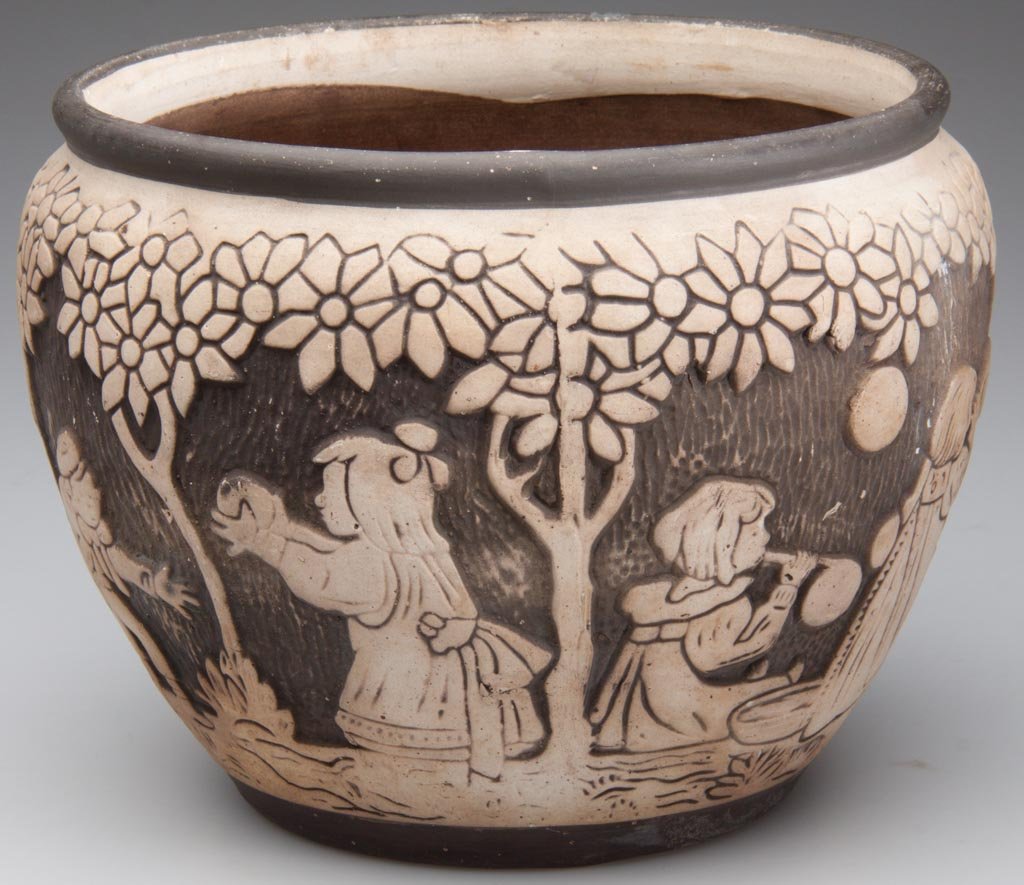 AMERICAN ART POTTERY WELLER BURNTWOOD JARDINIERE: AMERICAN ART POTTERY WELLER BURNTWOOD JARDINIERE, the rounded collar and tapering body molded and incised with children at play, impressed mark to underside. 1910s-1920s. 6 5/8" H. Provenance: Propert