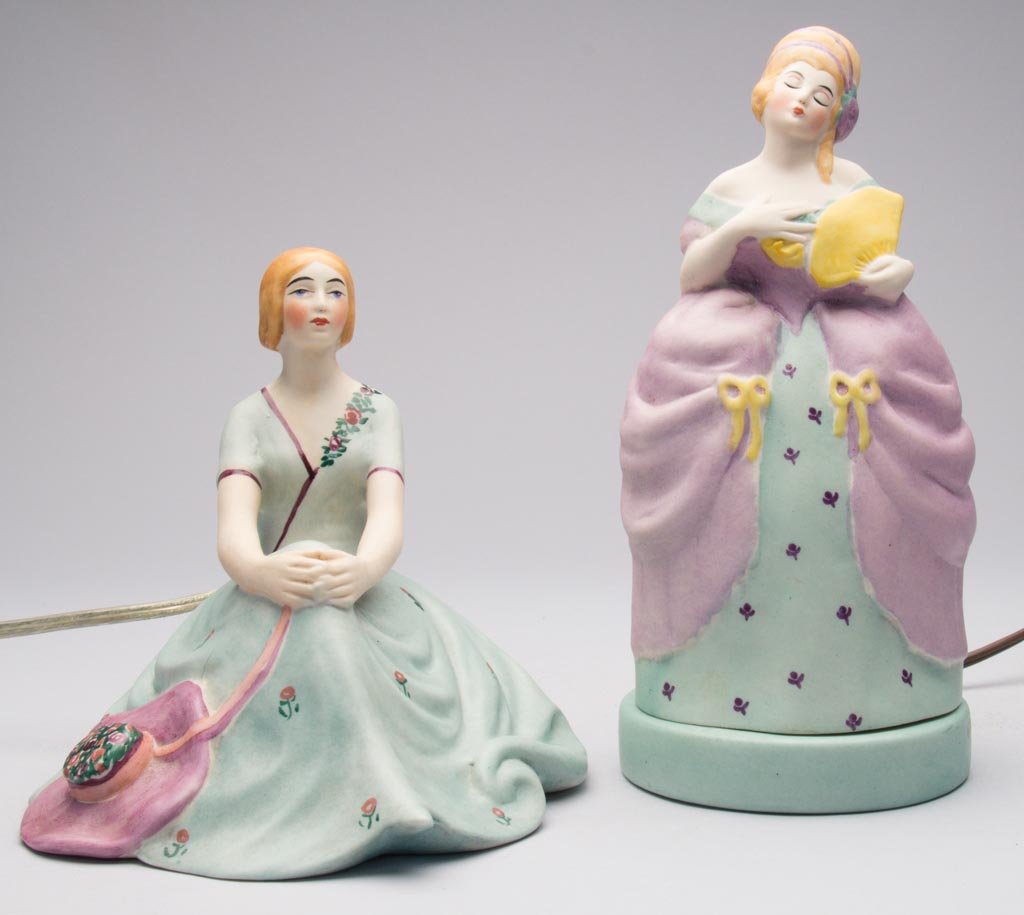AMERICAN POTTERY FULPER POTTERY ART DECO PORCELAIN TWO-: AMERICAN POTTERY FULPER POTTERY ART DECO PORCELAIN TWO-PART "MME. POMPADOUR" TWO-PART PERFUME LAMP, the standing female figure holding a yellow fan against her pale green and lilac dress, on a pale-gr