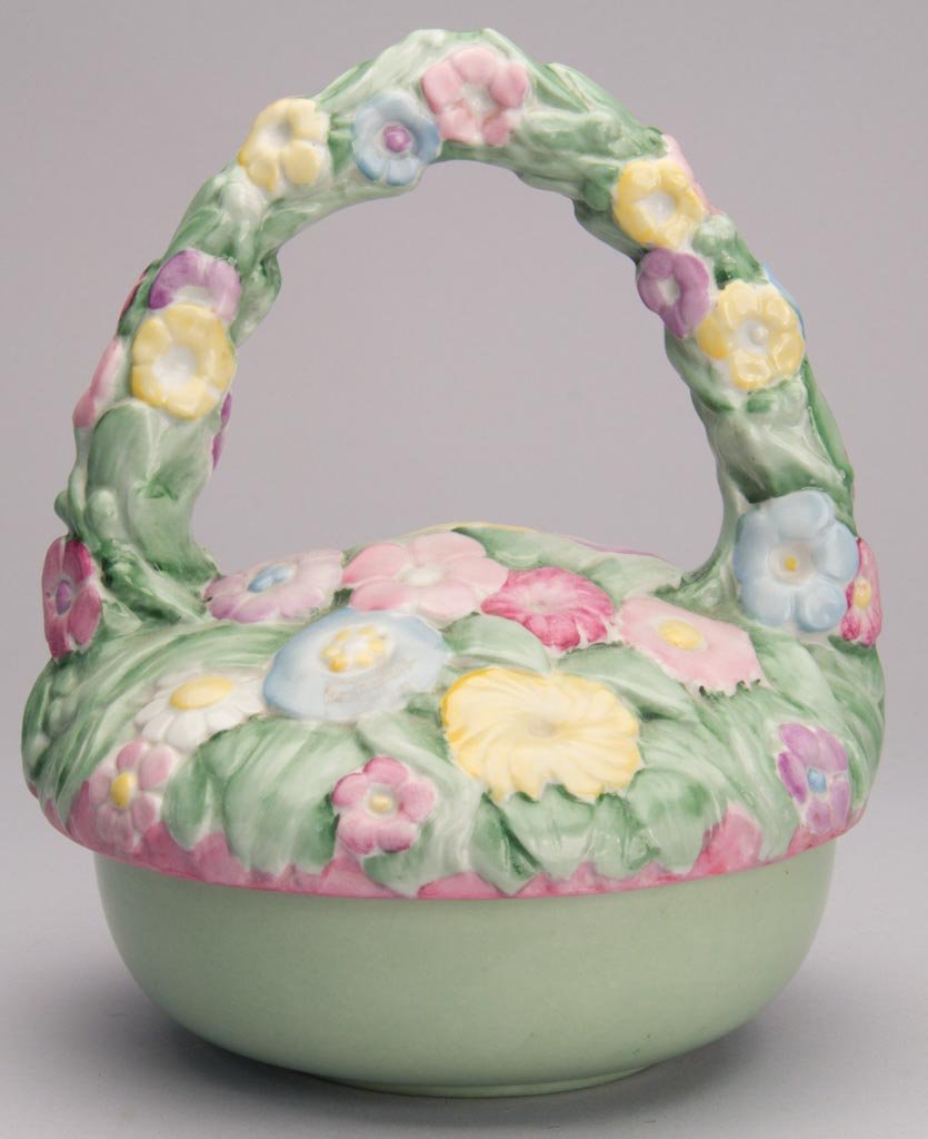 AMERICAN POTTERY FULPER POTTERY COMPANY ART DECO PORCEL: AMERICAN POTTERY FULPER POTTERY COMPANY ART DECO PORCELAIN BOWL AND BASKET-SHAPED COVER, the top molded in low relief with pastel flowerheads and leaves; the base formed as a bowl with green glaze to 