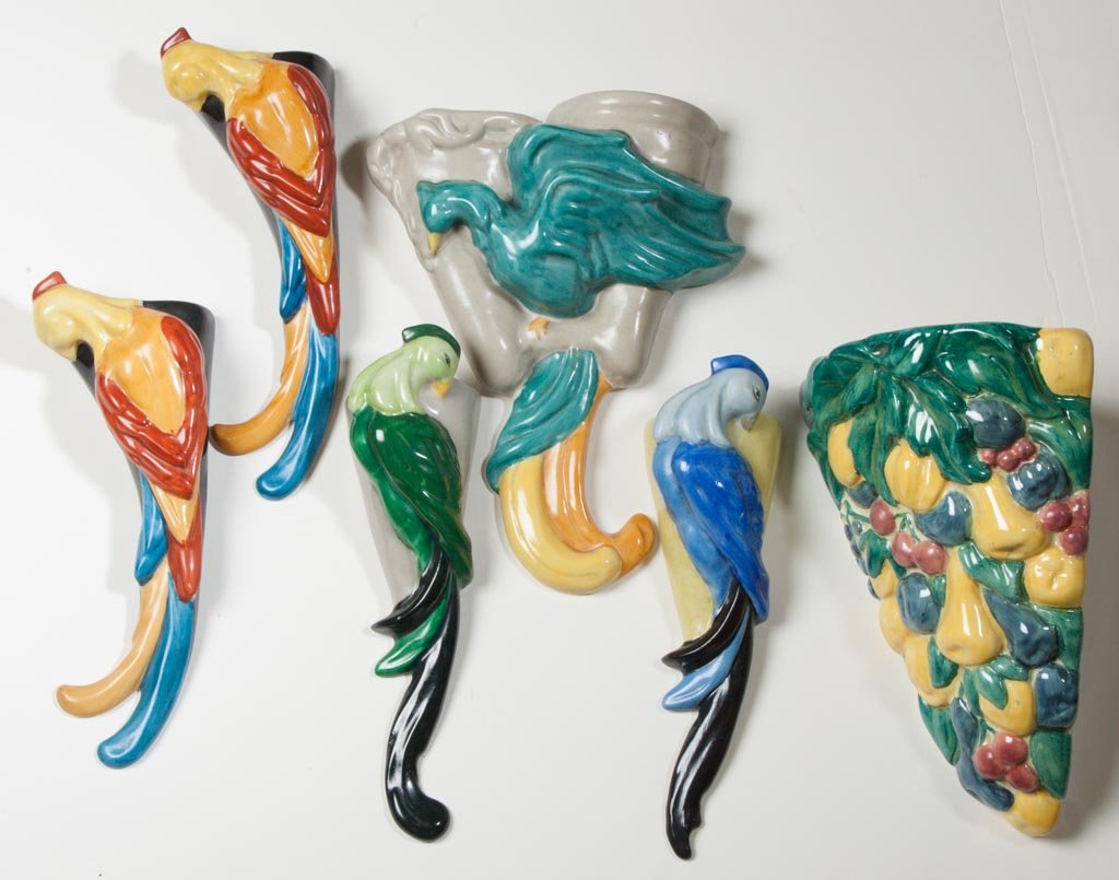 AMERICAN POTTERY FULPER POTTERY COMPANY ART DECO SIX WA: AMERICAN POTTERY FULPER POTTERY COMPANY ART DECO SIX WALL POCKETS OR WALL VASES, INCLUDING FOUR OF BIRD FORM, one of double-bird wall form, and one corner wall pocket vase molded as fruit. The green a