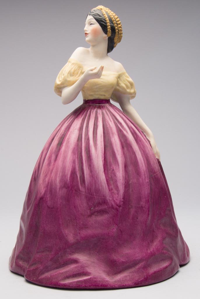 AMERICAN POTTERY FULPER POTTERY COMPANY ART DECO PORCEL: AMERICAN POTTERY FULPER POTTERY COMPANY ART DECO PORCELAIN CYTHEREA DOLL PERFUME BOUDOIR LAMP TOP, the standing figure of Cytherea in yellow and purple dress, striking a dramatic pose. 1920s. 11" H. P