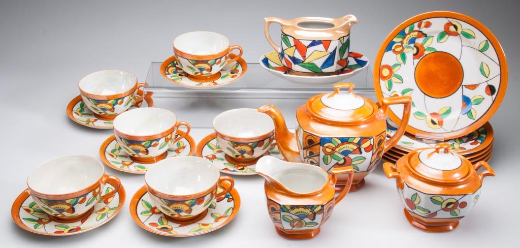 ART DECO JAPANESE PORCELAIN TASHIRO SHOTEN CHIKUSA LUST: ART DECO JAPANESE PORCELAIN TASHIRO SHOTEN CHIKUSA LUSTERWARE TEASET, consisting of a teapot and cover; sugar pot and cover, creamer and six trios each made up of a teacup, saucer and luncheon plate, 