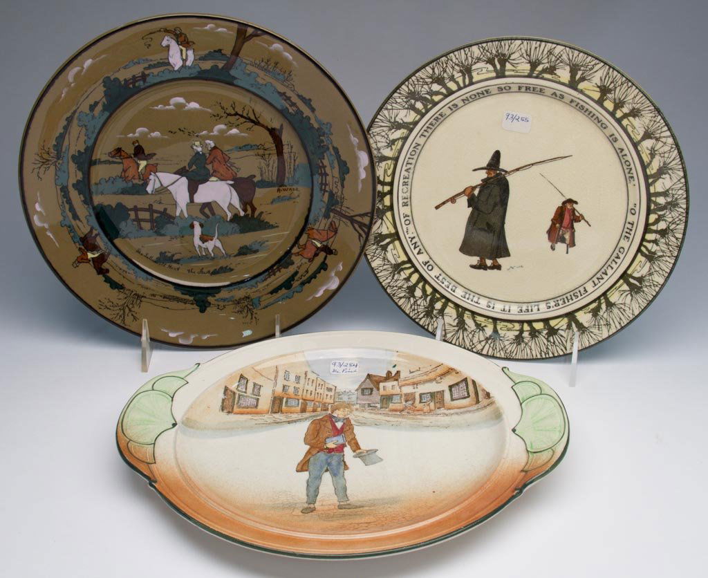 STAFFORDSHIRE POTTERY ROYAL DOULTON SERIES WARE TWO PLA: STAFFORDSHIRE POTTERY ROYAL DOULTON SERIES WARE TWO PLATES, AND A BUFFALO POTTERY DELDAREWARE PLATE, including an Isaac Walton Ware plate with two fishermen and their rods; a Dickens Ware "Tom Pinck"