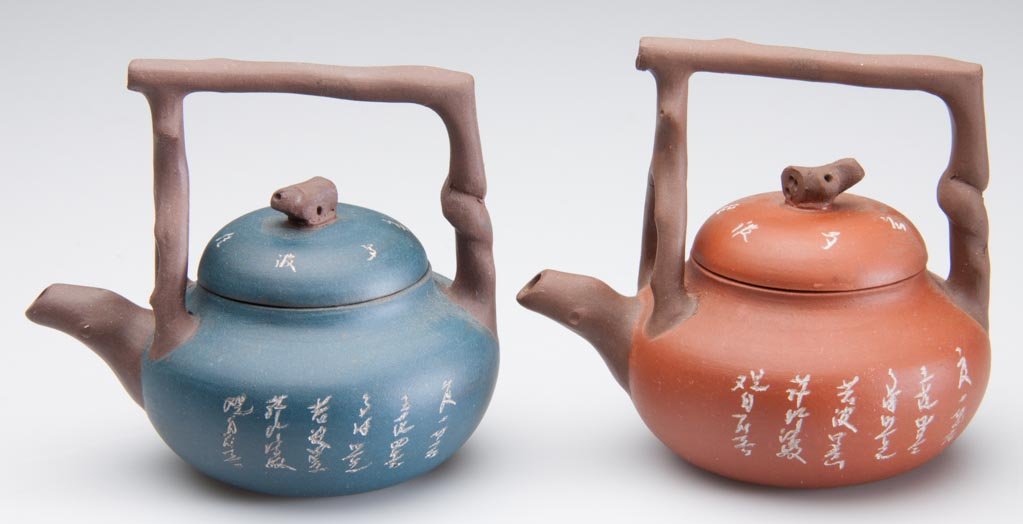 CHINESE YIXING ZISHA CLAY ARTISTIC MINIATURE TEAPOTS, L: CHINESE YIXING ZISHA CLAY ARTISTIC MINIATURE TEAPOTS, LOT OF TWO, the globular bodies with dark-brown branch-form, pronged high handle straddling the root-form spout, with domed lids and root-form kno
