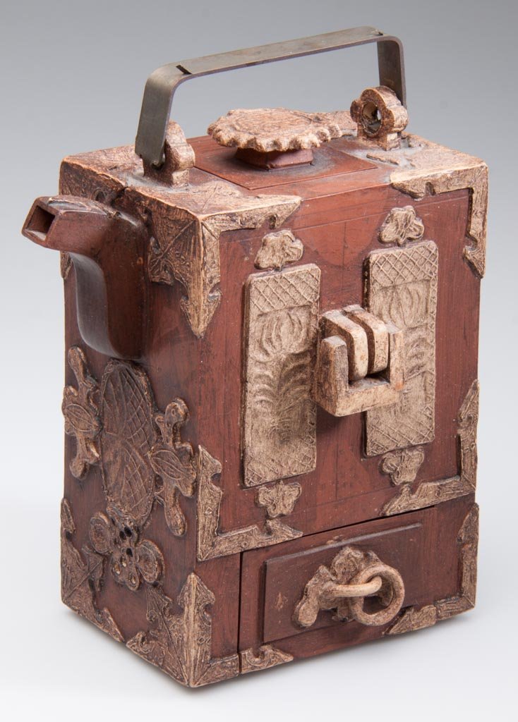 CHINESE YIXING ZISHA CLAY ARTISTIC TEAPOT AND COVER, IN: CHINESE YIXING ZISHA CLAY ARTISTIC TEAPOT AND COVER, IN THE FORM OF A CABINET, the tall, rectangular brown body, with numerous applied faux-hinges and other decorative elements in light brown clay, th