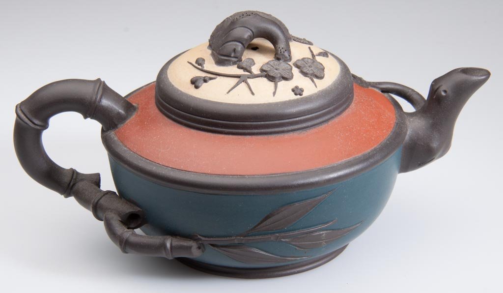 CHINESE YIXING ZISHA CLAY ARTISTIC "THREE FRIENDS" THEM: CHINESE YIXING ZISHA CLAY ARTISTIC "THREE FRIENDS" THEME TEAPOT AND COVER, a squat, globular teapot and cover of four-color clay combination, with redware shoulder over tapering blue waist, the light-