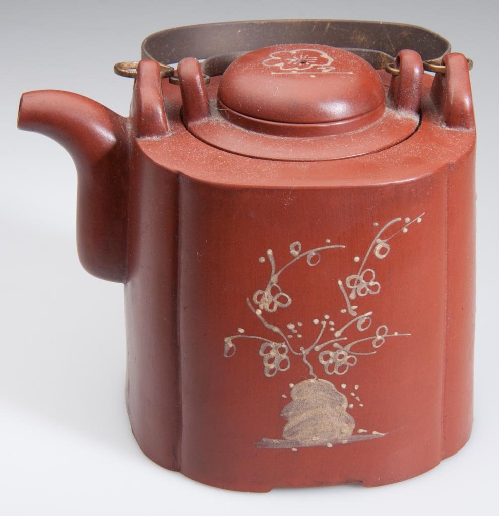 CHINESE YIXING ZISHA CLAY ARTISTIC POLISHED RED TEAPOT : CHINESE YIXING ZISHA CLAY ARTISTIC POLISHED RED TEAPOT AND COVER, of square form with lobed sides, with infuser insert under the cover, and lug-form anchors for two brass handles, arcing over the body