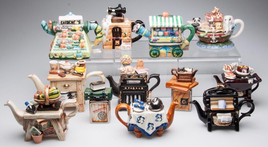 PORCELAIN NOVELTY TEAPOTS, LOT OF 12, INCLUDING EXAMPLE: PORCELAIN NOVELTY TEAPOTS, LOT OF 12, INCLUDING EXAMPLES BY PAUL CARDEW, TEE-NEE, TONY CARTER AND OTHERS, the small models in the form of radios, sewing machines, room delivery carts; gardener's and b