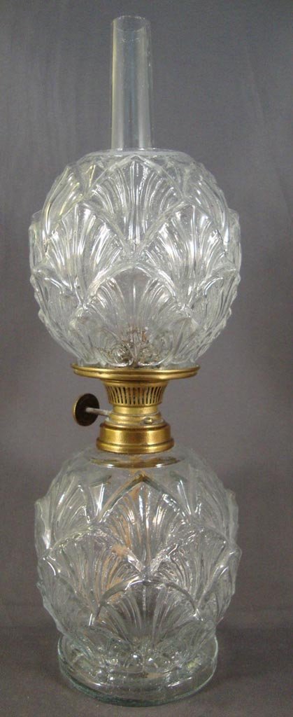 SHELL MINIATURE LAMP: SHELL MINIATURE LAMP, colorless, matching shade. Period burner. Fourth quarter 19th/early 20th century. 8 1/2" H to top of shade, 4 1/2" to top of collar, 3 1/4" D base. Literature: Smith - Miniature 