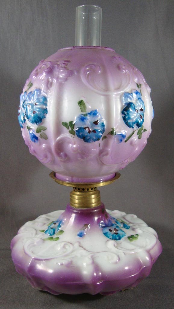 SPIDER WEB / PANSY MINIATURE LAMP: SPIDER WEB / PANSY MINIATURE LAMP, opaque white with fired décor in lavender, blue and green, matching ball shade. Period burner. Fostoria Glass Co. Fourth quarter 19th/early 20th century. 7 7/8" H t