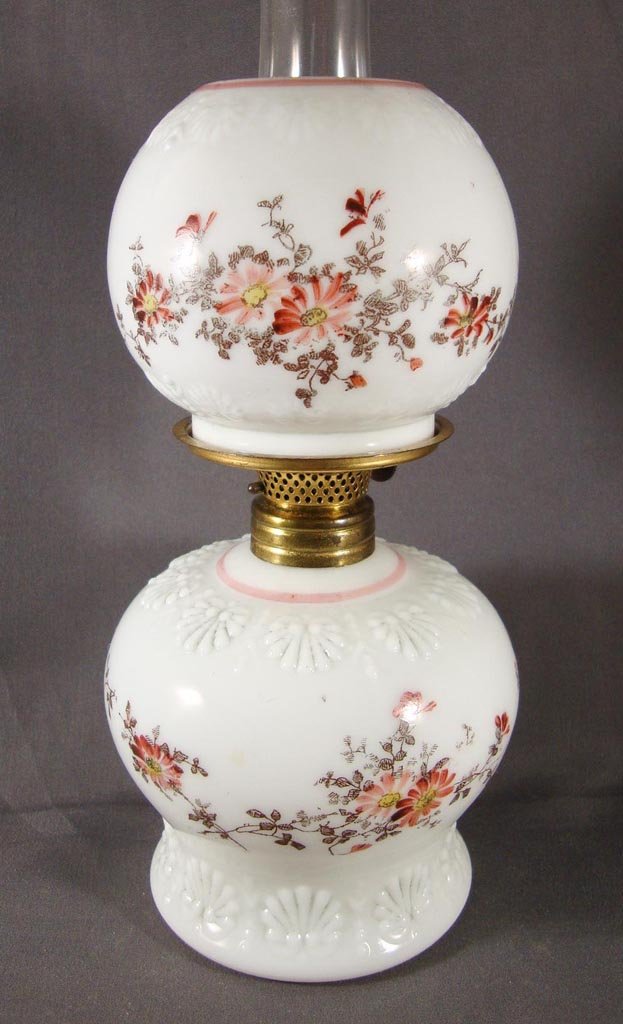 SHELL AND FLORAL MINIATURE LAMP: SHELL AND FLORAL MINIATURE LAMP, opaque white, décor in pink, wine, black and yellow, matching ball shade. Period burner. Fourth quarter 19th/early 20th century. 7 1/4" H to top of shade, 3 3/4" to t