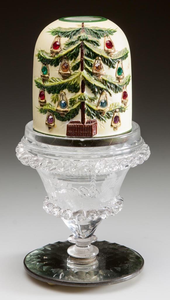 AUSTRIAN PORCELAIN FAIRY LAMP ON STANDARD: AUSTRIAN PORCELAIN FAIRY LAMP ON STANDARD, fairy-size bisque dome with polychrome decoration depicting a Christmas tree on each side set with jeweled hanging lights, fitted on a Clarke's colorless lam