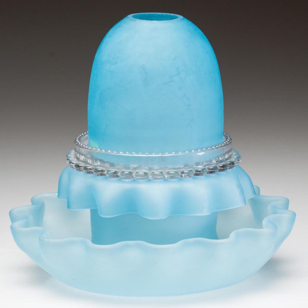 SATIN GLASS FAIRY LAMP: SATIN GLASS FAIRY LAMP, soft blue, fairy-size dome fitted on a colorless Clarke's lamp cup with Clarke's candle cup, and original ruffled flower-trough base with down-turned post. Fourth quarter 19th 