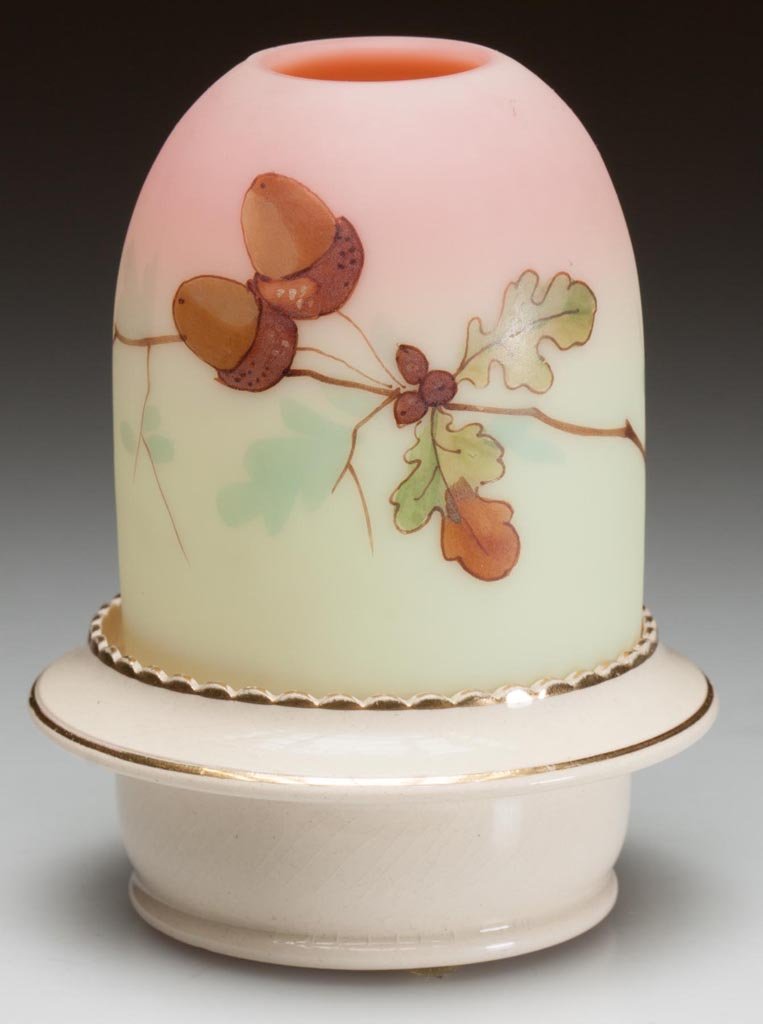 WEBB BURMESE AND CERAMIC FAIRY LAMP: WEBB BURMESE AND CERAMIC FAIRY LAMP, plush finish, pyramid-size dome with hand-painted polychrome acorn decoration, fitted on a ceramic lamp cup with S. Clarke's patent, bottom marked for Taylor, Tunn