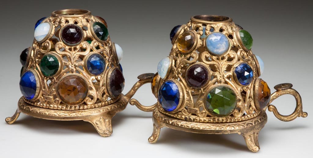 JEWELED GILDED CAST-BRASS PAIR OF FAIRY LAMPS: JEWELED GILDED CAST-BRASS PAIR OF FAIRY LAMPS, each dome set with colored-glass faceted jewels, on original locking base with finger ring and three tab feet, original metal candle cups. Possibly Bradl