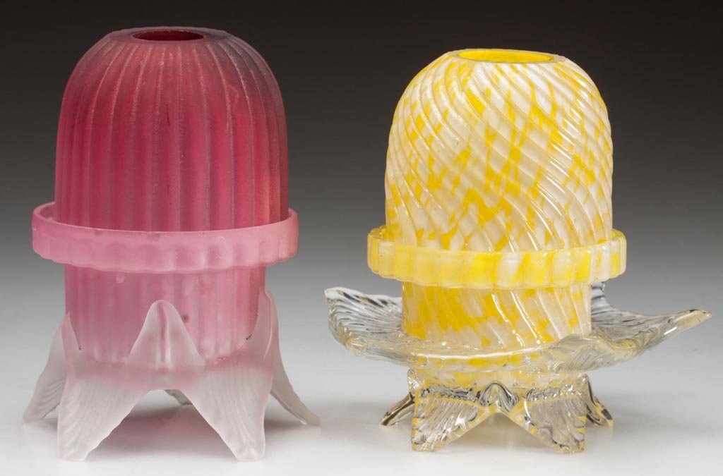BLOWN-MOLDED GLASS FAIRY LAMPS, LOT OF TWO: BLOWN-MOLDED GLASS FAIRY LAMPS, LOT OF TWO, mottled yellow and opal, and pink satin, each pyramid-size dome with two ground air vents, one with ribs swirled to the left and other with vertical ribs, e