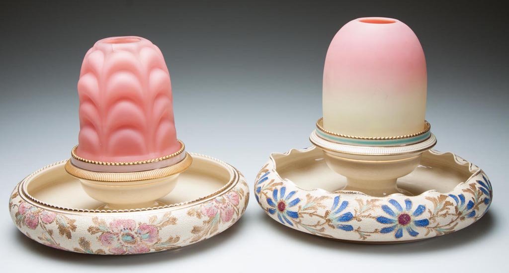 GLASS AND CERAMIC FAIRY LAMPS, LOT OF TWO: GLASS AND CERAMIC FAIRY LAMPS, LOT OF TWO, each fairy-size dome fitted on a ceramic lamp cup with S. Clarke's patent and integral Tapestry Ware flower-bowl base marked for Taylor, Tunnicliffe & Co. Fo