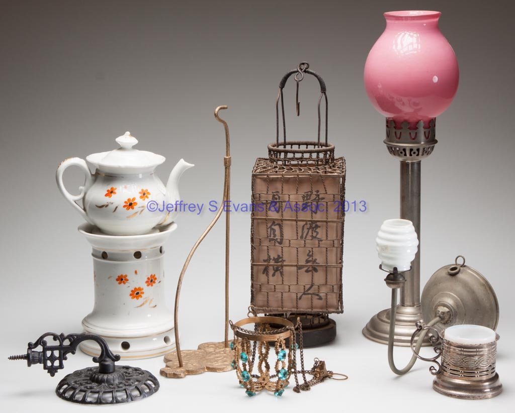 ASSORTED LIGHTING RELATED ARTICLES, LOT OF EIGHT: ASSORTED LIGHTING RELATED ARTICLES, LOT OF EIGHT, including a three-part porcelain tea warmer and a jeweled gilt-brass hanging frame for a candle cup. Fourth quarter 19th/first quarter 20th century. T