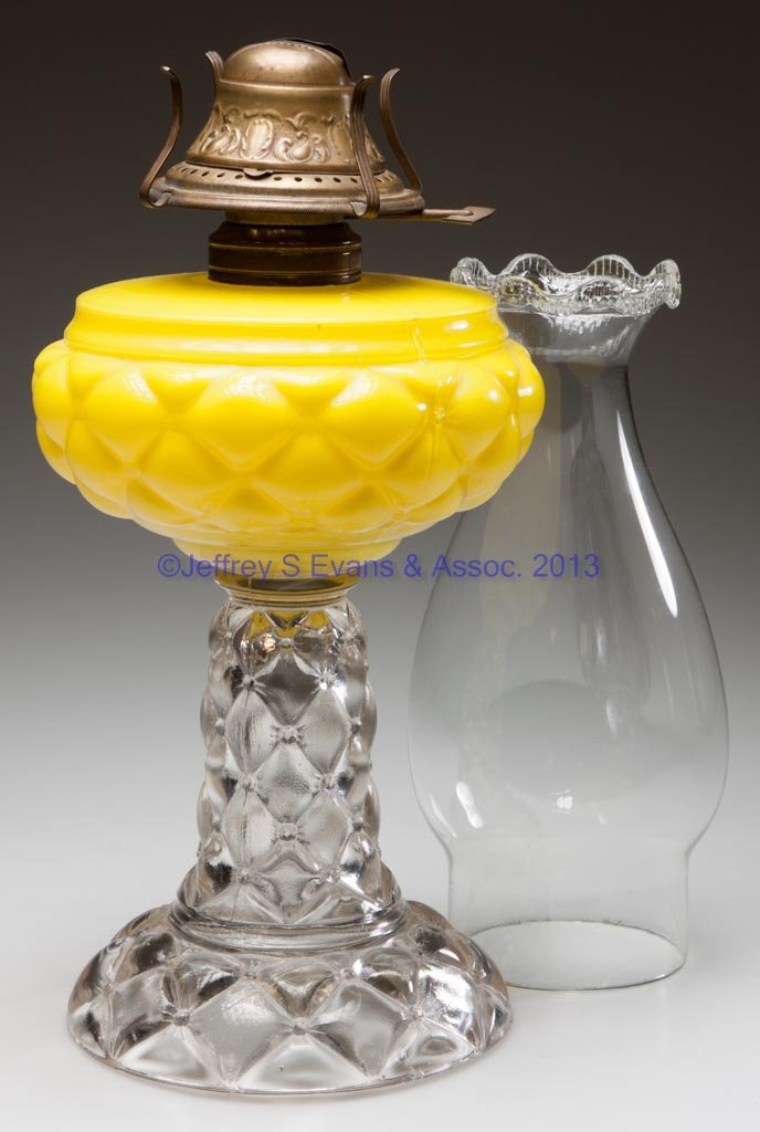 QUILT / FLORETTE STAND LAMP: QUILT / FLORETTE STAND LAMP, cased lemon yellow font, colorless base, No. 2 Taplin-Brown collar. Fitted with a period set-up comprising a No. 2 Upton slip burner and chimney with serrated-scalloped to