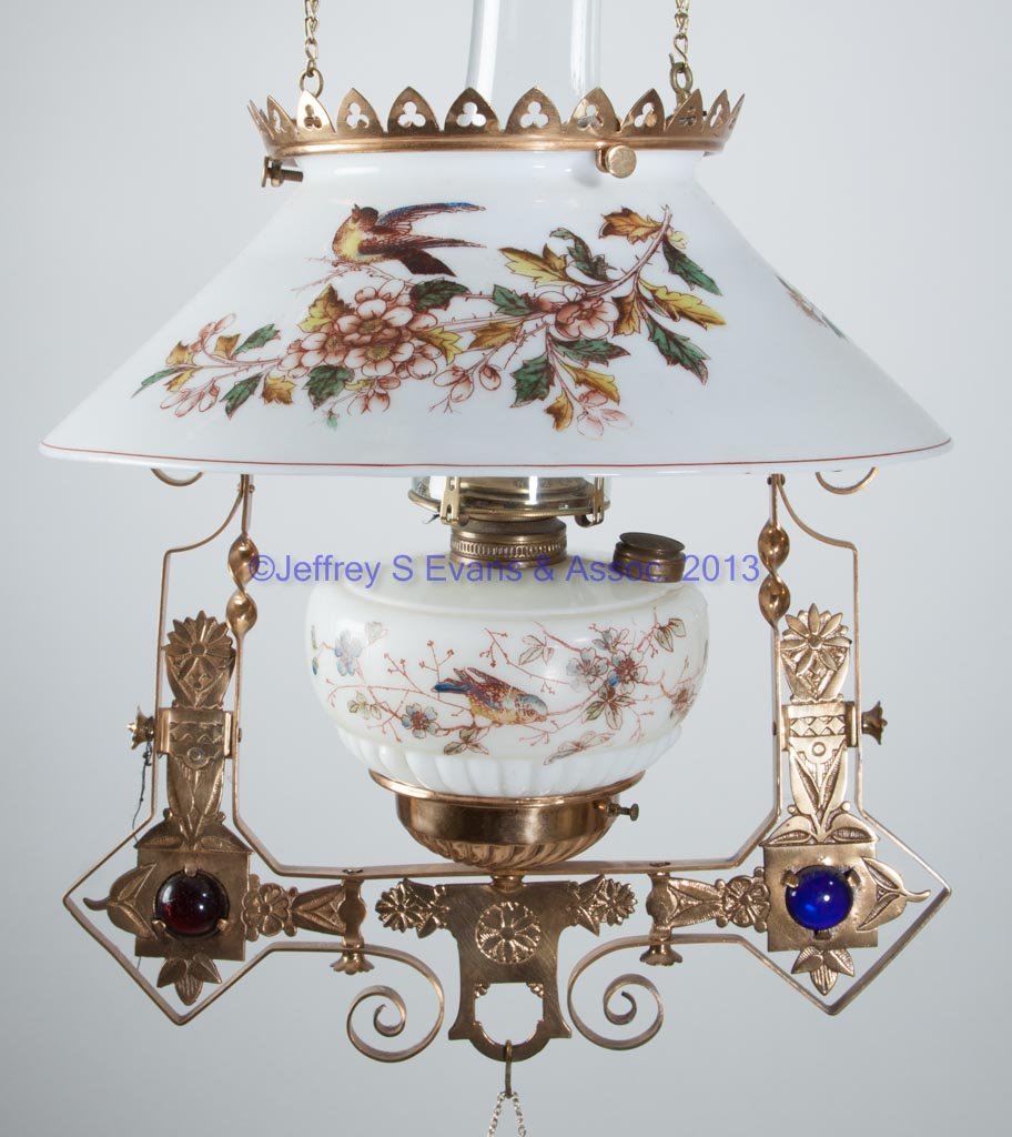VICTORIAN BRASS-FRAME HANGING LIBRARY LAMP: VICTORIAN BRASS-FRAME HANGING LIBRARY LAMP, polychrome transfer-decorated opal cone-form shade depicting birds and flowering dogwood branches, opal font with similar dogwood decoration and side-refill