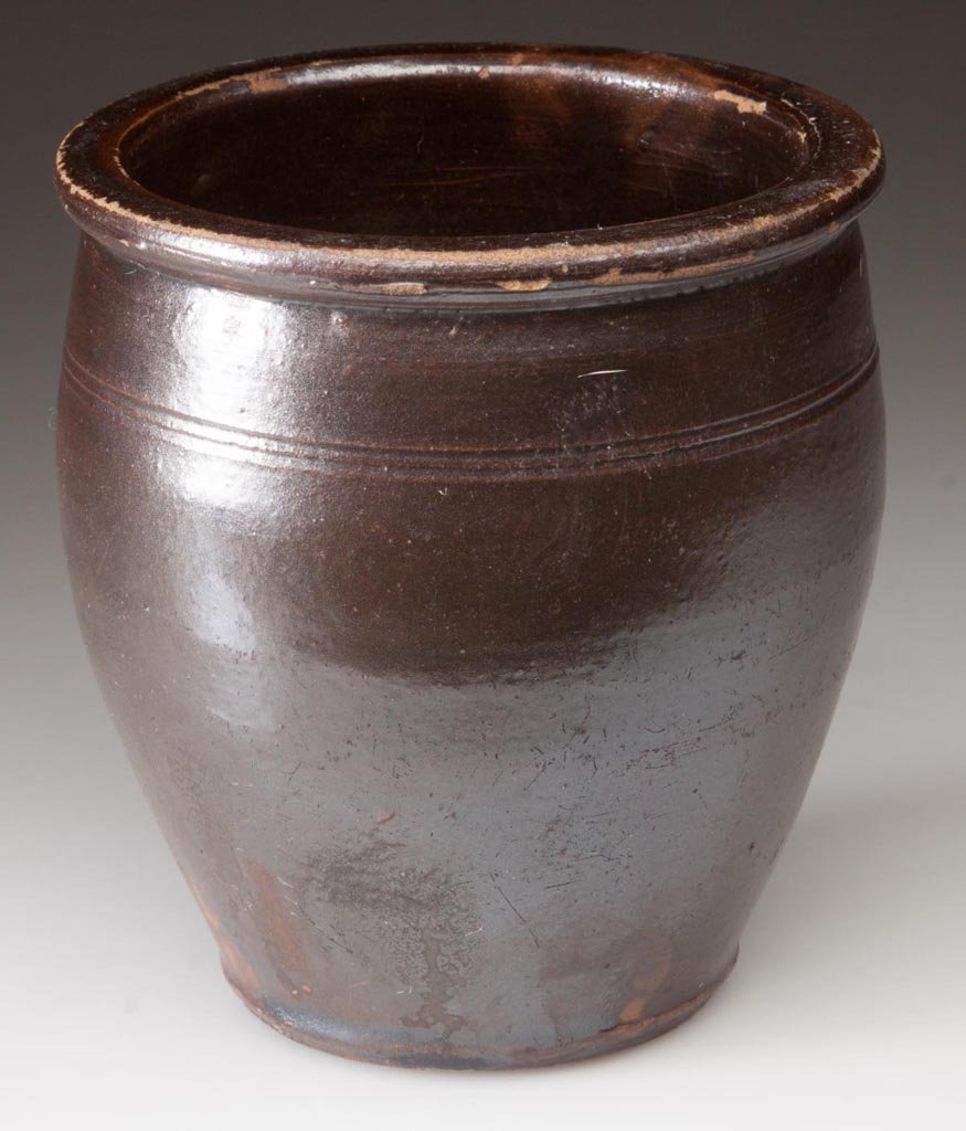 HARRISONBURG STEAM POTTERY, SHENANDOAH VALLEY OF: HARRISONBURG STEAM POTTERY, SHENANDOAH VALLEY OF VIRGINIA STONEWARE MINIATURE CROCK, brown Albany-slip glazed, 1 pint capacity, wide-mouth form with two incised rings below the flat-top rim. Emanuel S