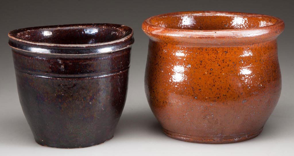 MID-ATLANTIC EARTHENWARE / REDWARE DIMINUTIVE CROCKS,: MID-ATLANTIC EARTHENWARE / REDWARE DIMINUTIVE CROCKS, LOT OF TWO, comprising a lead-glazed example with slightly flared rim and beaded foot, and a lead- and manganese-glazed example with squared rim a
