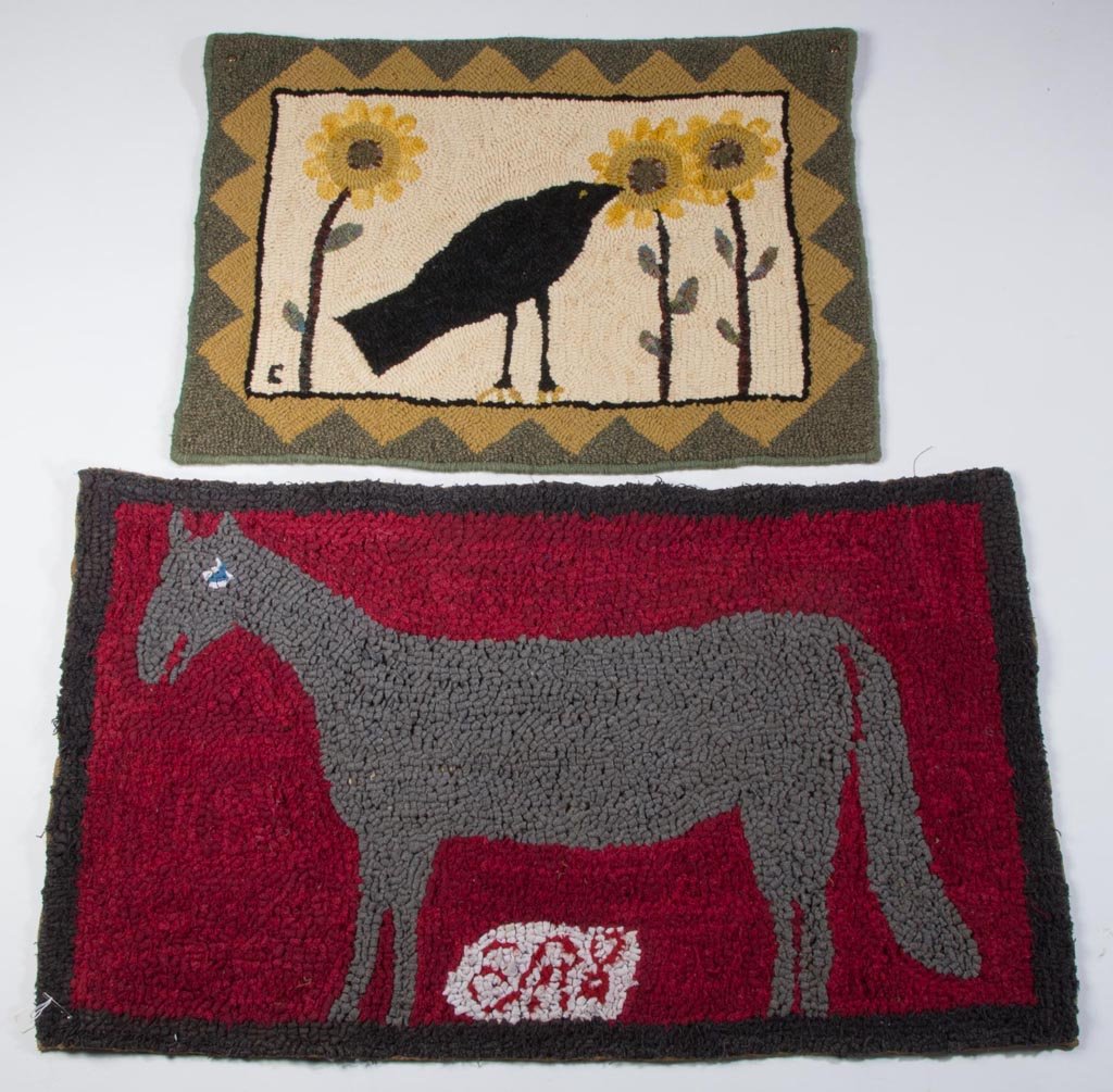 AMERICAN PICTORIAL HOOKED RUGS, LOT OF TWO: AMERICAN PICTORIAL HOOKED RUGS, LOT OF TWO, comprising an example depicting a large grey horse on red ground over initials "E.A.S" (?) and a smaller example depicting a crow flanked by sunflowers. 20t