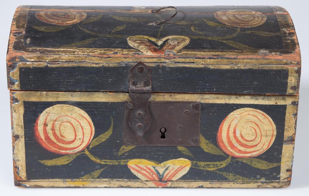 BUCHER-STYLE PAINT-DECORATED PINE BOX: BUCHER-STYLE PAINT-DECORATED PINE BOX, dome-top cotter-pin hinged lid, original sheet-iron hasp and lock. Original dry polychrome-painted floral decorations. First half 19th century. 5 1/8" H, 9" x 5"